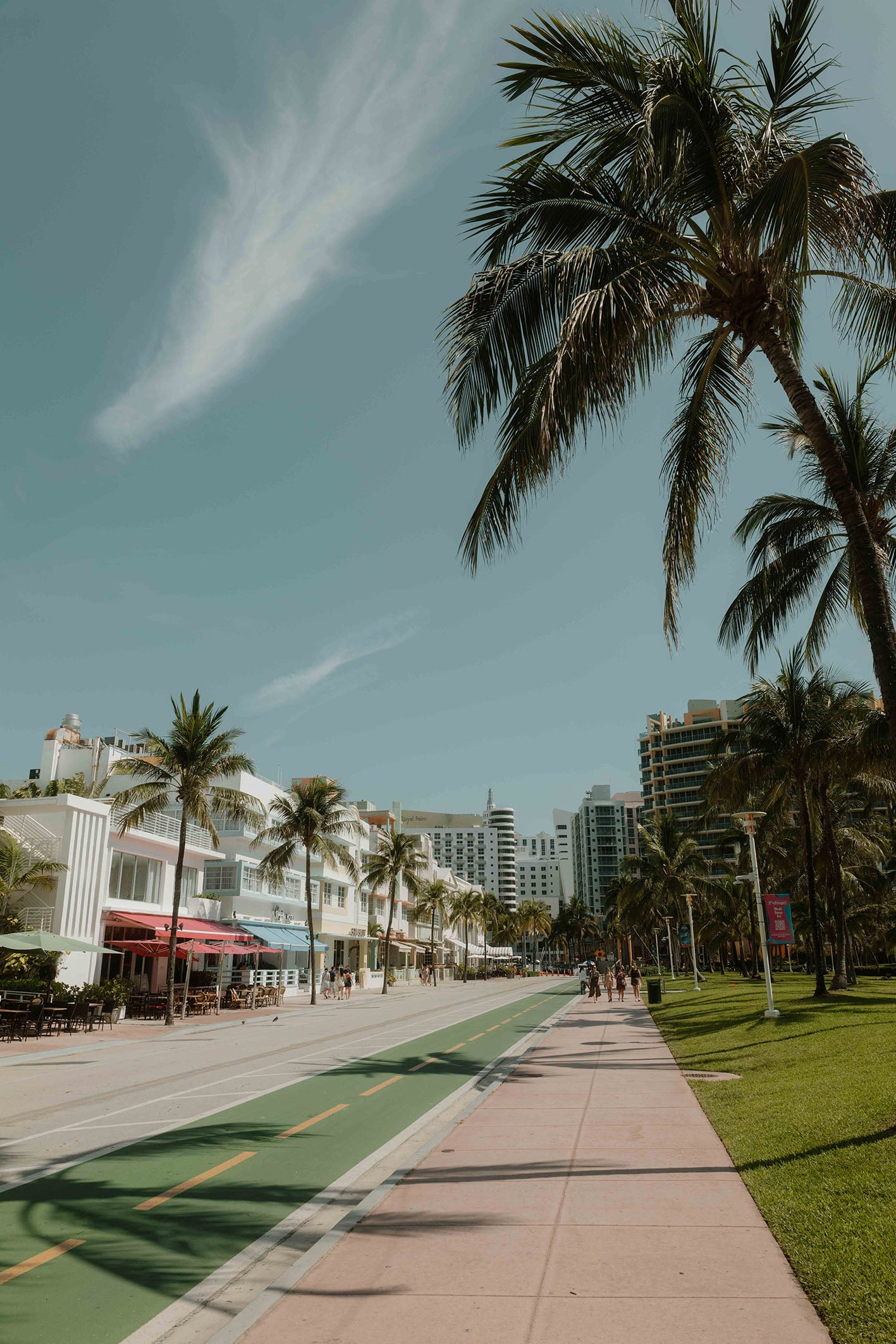 A ready-to-hang framed photography print by Hannes Klaeger. Palm shadows gently sway along the pastel-coloured beachfront in Miami’s Art Deco District – an iconic neighbourhood that oozes genuine vintage charm.