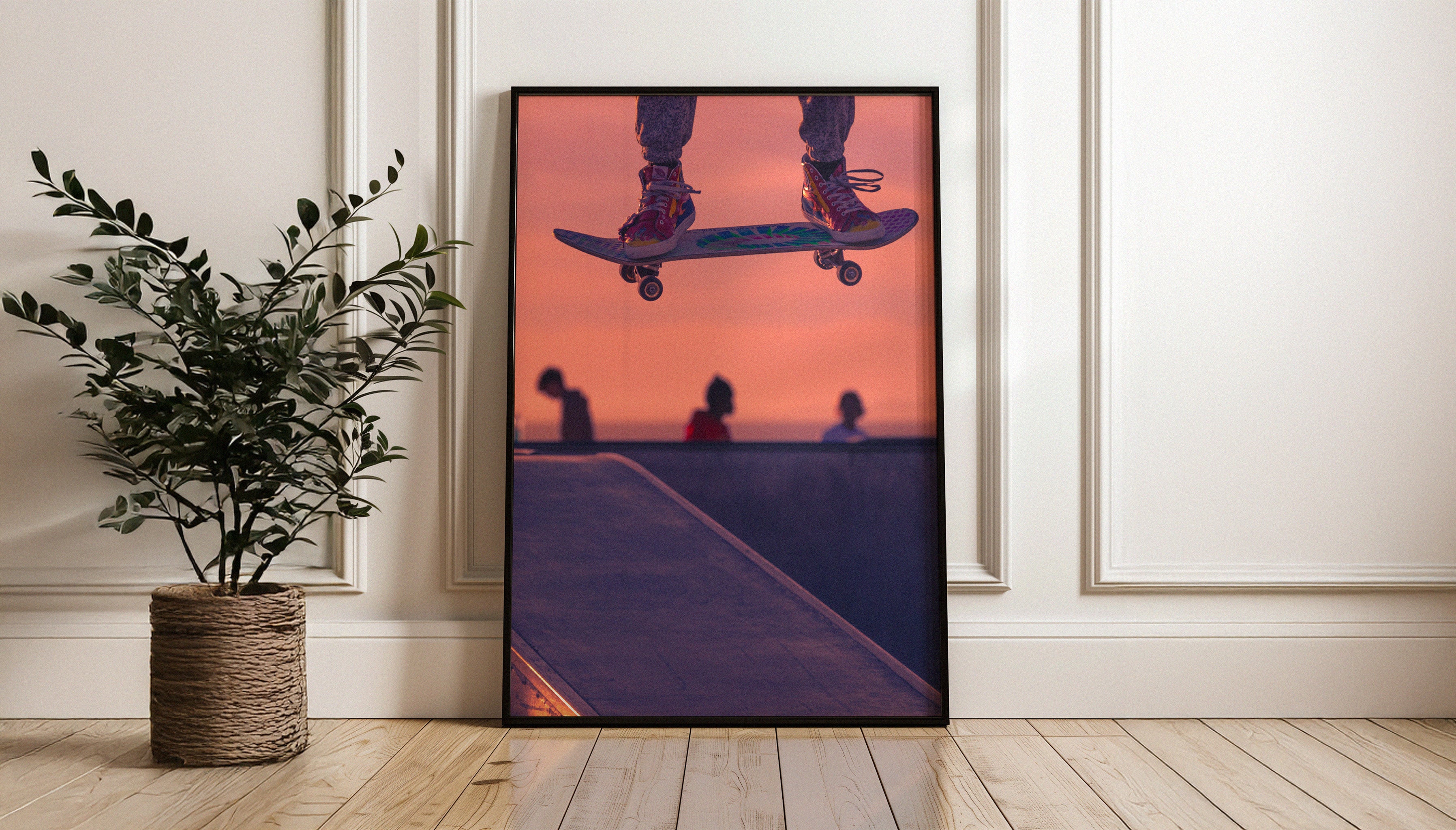 AIRLINE fine art print by Craig Hubbard leaning against a white wall beside a plant – a contemporary skateboarding photo elevating minimalist home decor.