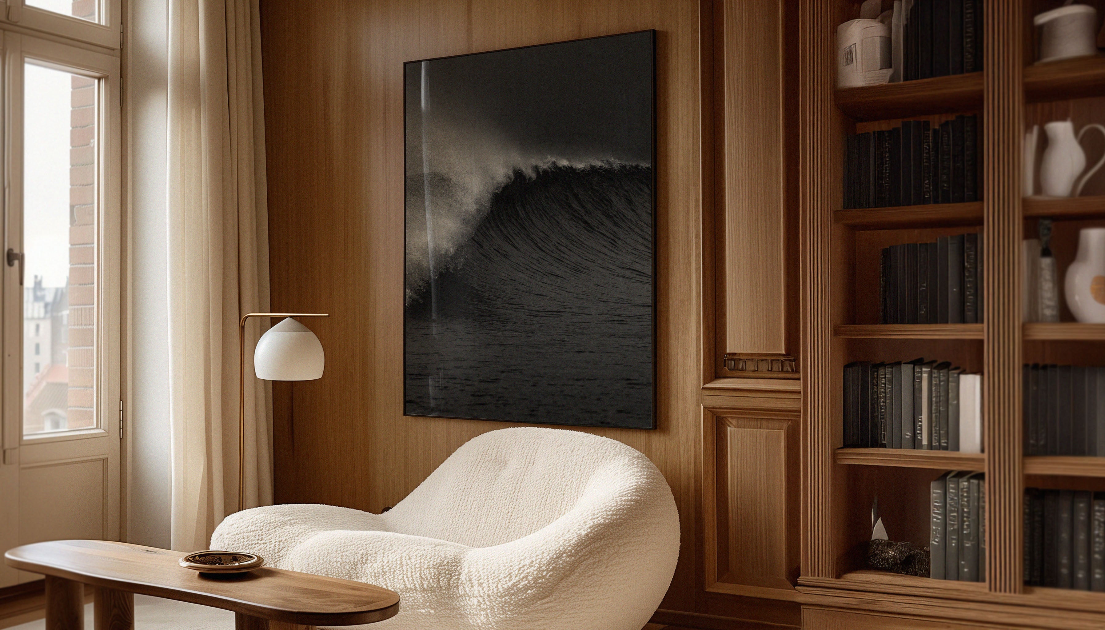 Venice Beach wave print by Craig Hubbard, ARROW, hanging in a cozy, wood-paneled living room with natural light.