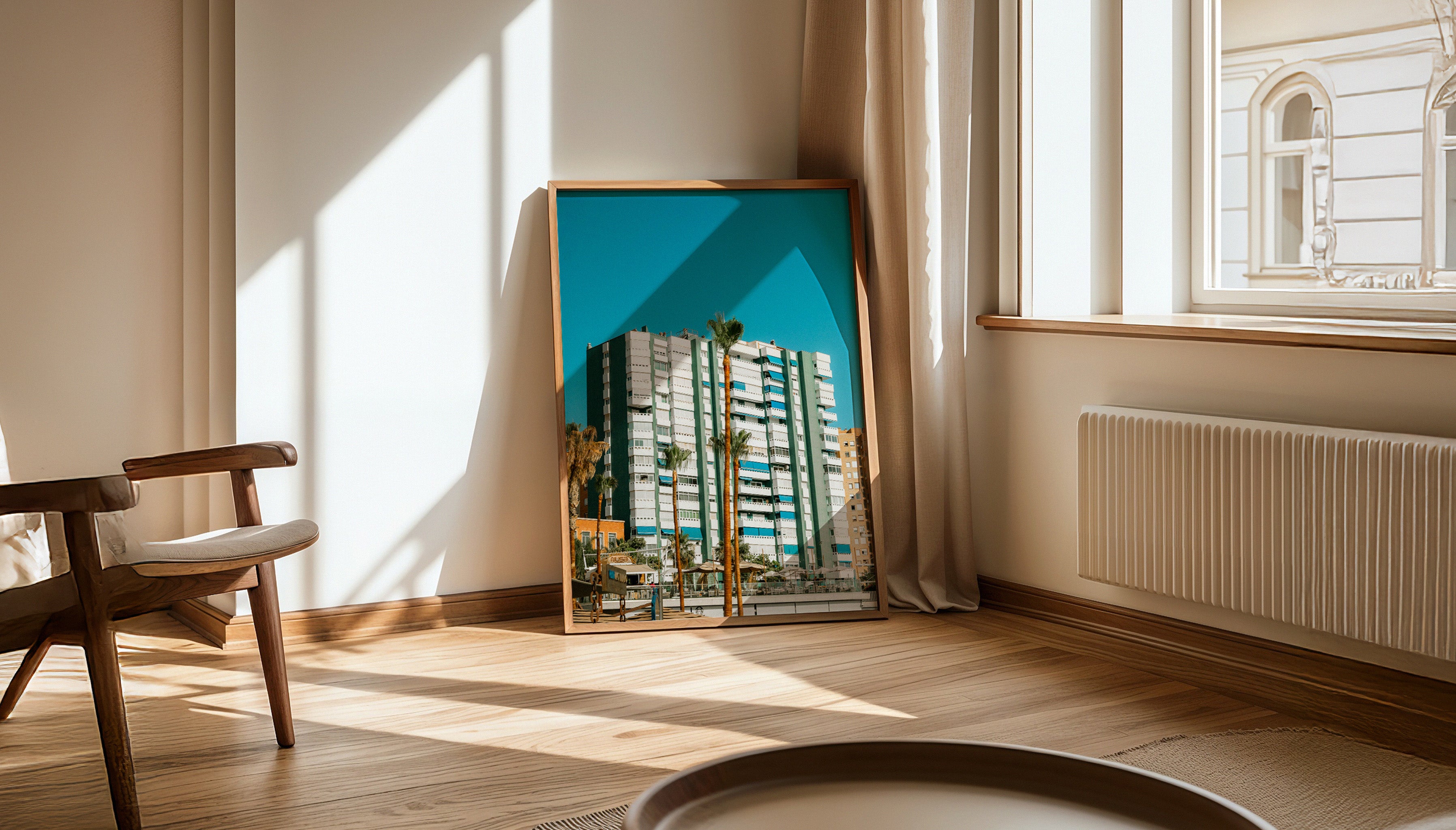 A wide view of Evie Johnstone's AVENIDA DEL MAR photography print in a wooden frame in a minimalist interior, a bright, colourful and bold print available ready-to-hang.