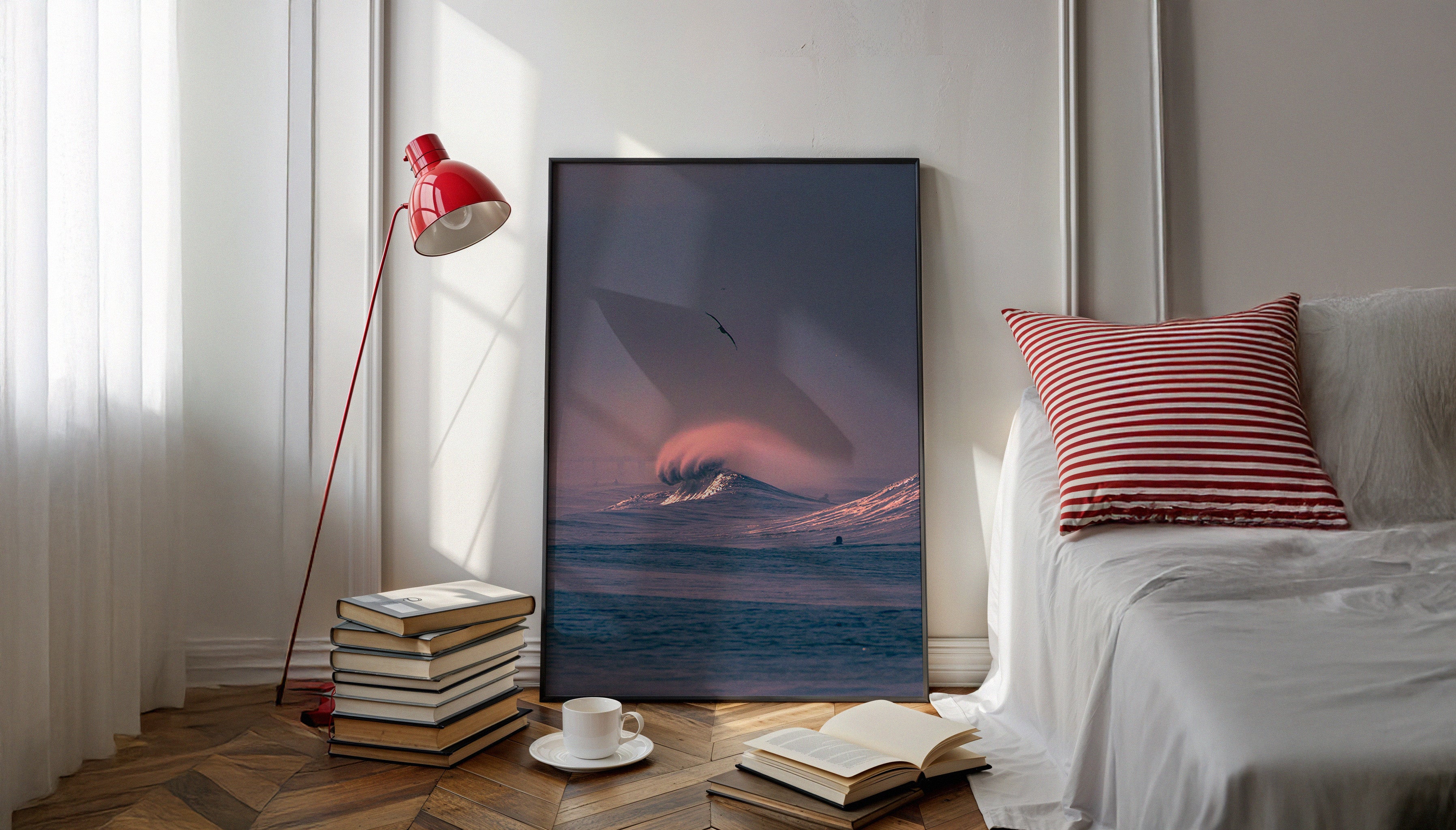 Large photographic print of a glowing wave and bird in flight leaning against a white wall in a sunlit modern interior, print by Craig Hubbard.