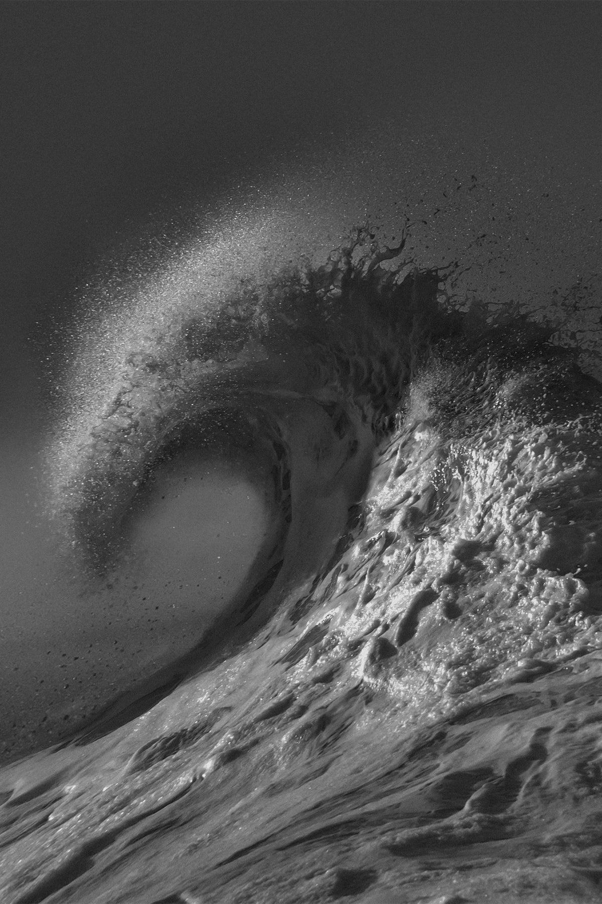 Black and white photograph of a crashing wave titled 'Dark Arc' by Craig Hubbard, captured at Venice Pier.