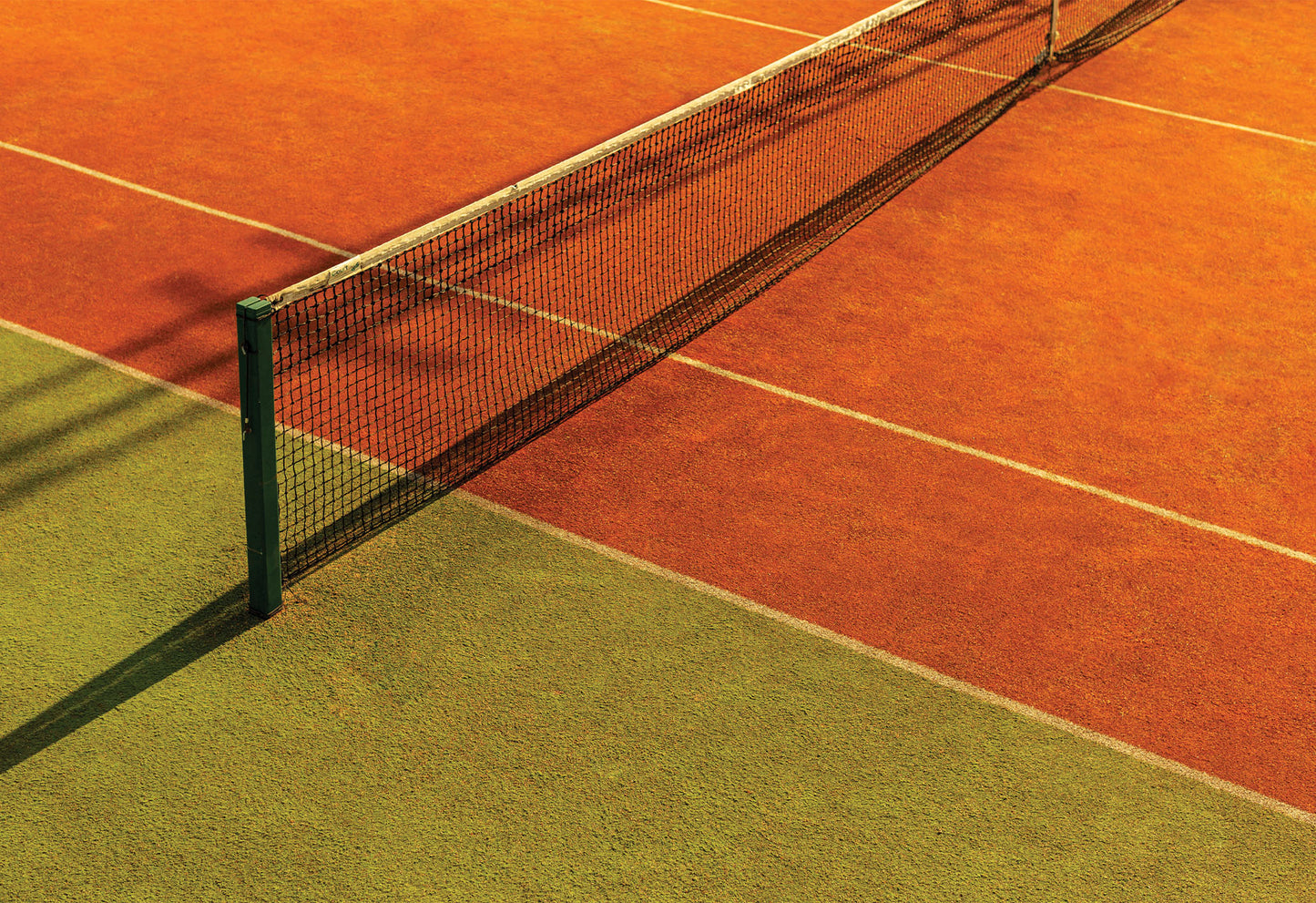A warm, bold coloured tennis court in Kutaisi, Georgia photographed by Will Bremridge. Available to purchase as a fine art photography print exclusively from The Lost Works.