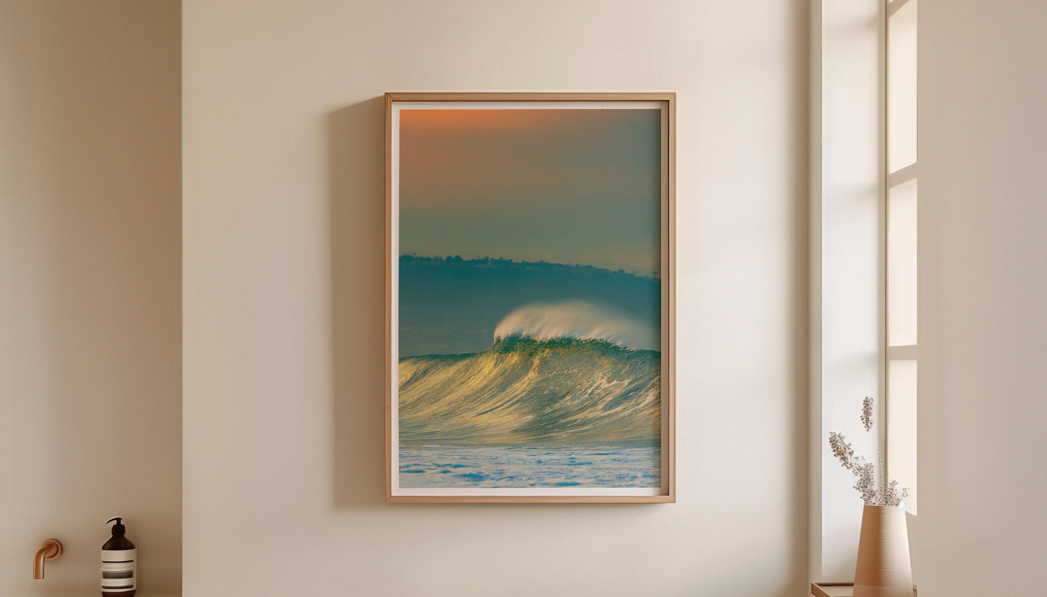 Golden wave print ‘LIME’ by Craig Hubbard framed and styled in a serene modern interior with soft beige walls and decorative ceramic accents.