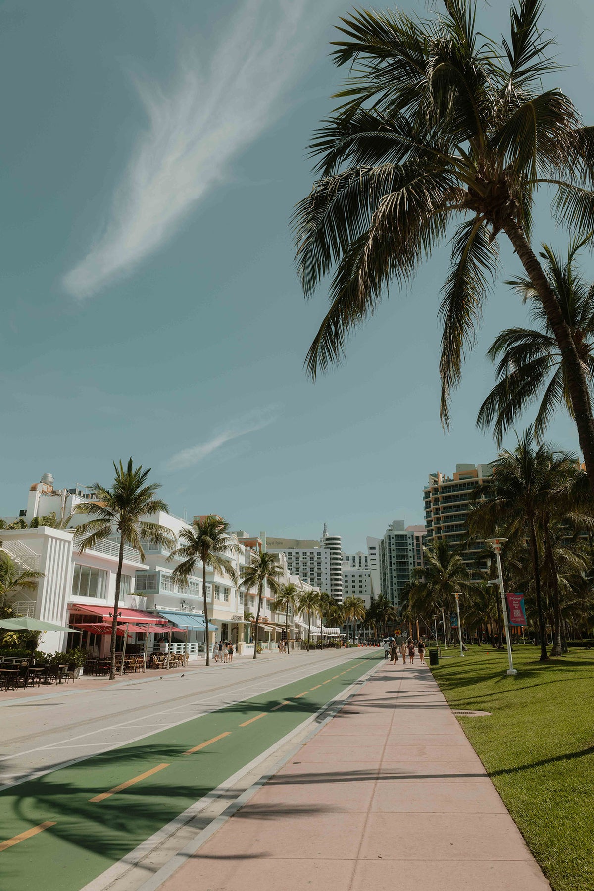 A ready-to-hang framed photography print by Hannes Klaeger. Palm shadows gently sway along the pastel-coloured beachfront in Miami’s Art Deco District – an iconic neighbourhood that oozes genuine vintage charm.