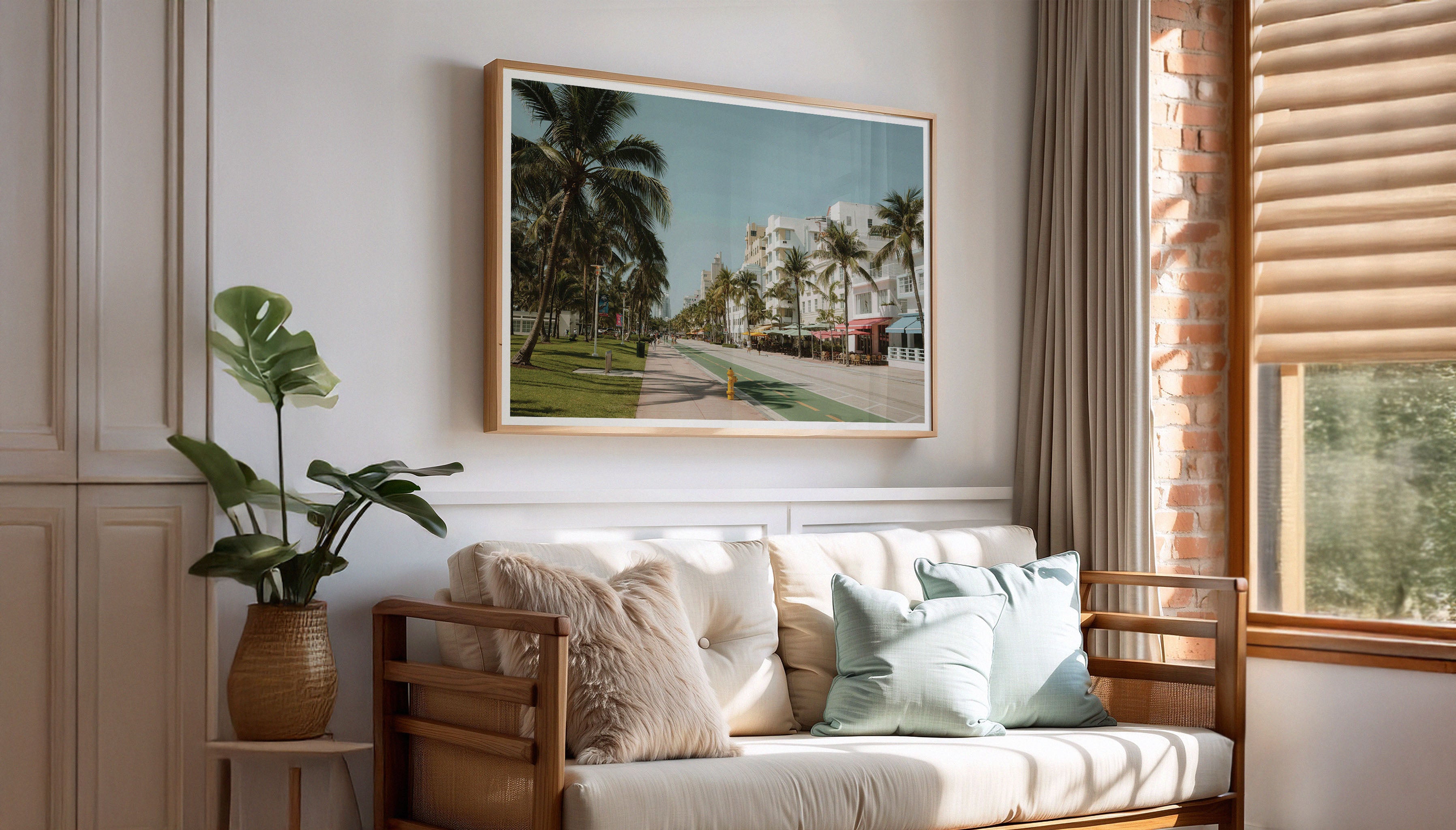 A fine art photography print by Hannes Kläger taken in Miami Beach's Art Deco District. Soft pastel hues, bold geometric patterns and nostalgic architectural details combined with palm trees and blue skies. Available to purchase as wall art from The Lost Works.
