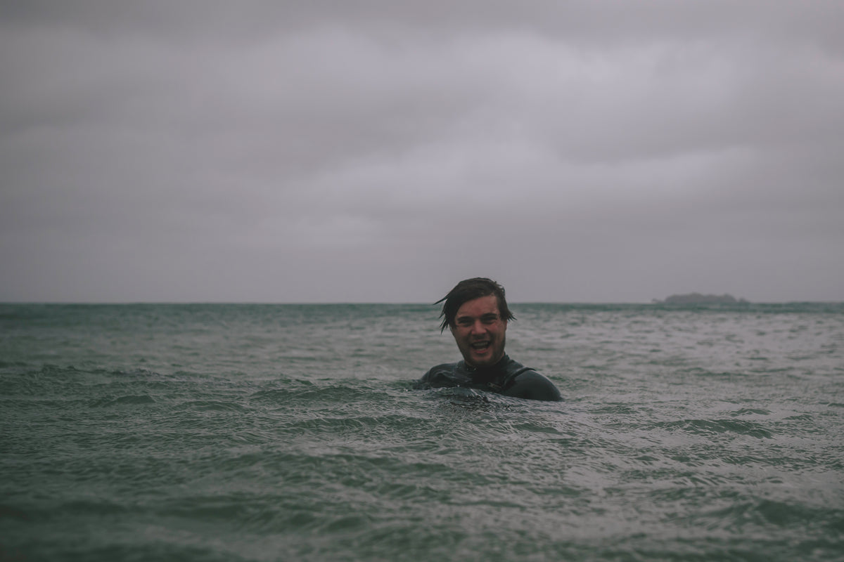 Biography image of Chris Hall in the sea, a photographer on the artist roster of The Lost Works gallery.