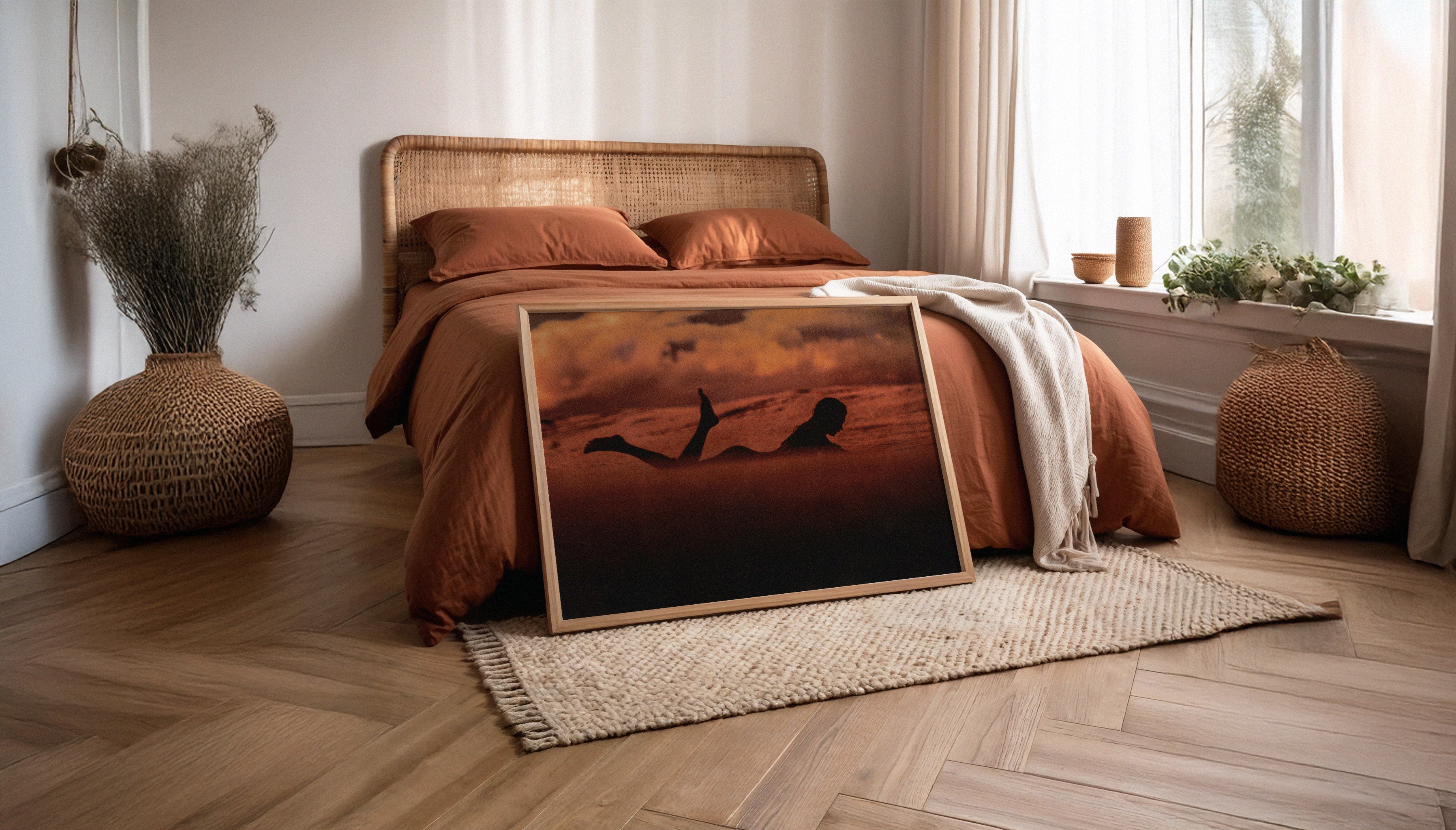 Interior view of a sunlit bohemian bedroom featuring the ‘Silhouette’ framed print by Ez Rivero, evoking serene travel vibes from Santa Teresa’s surf culture.