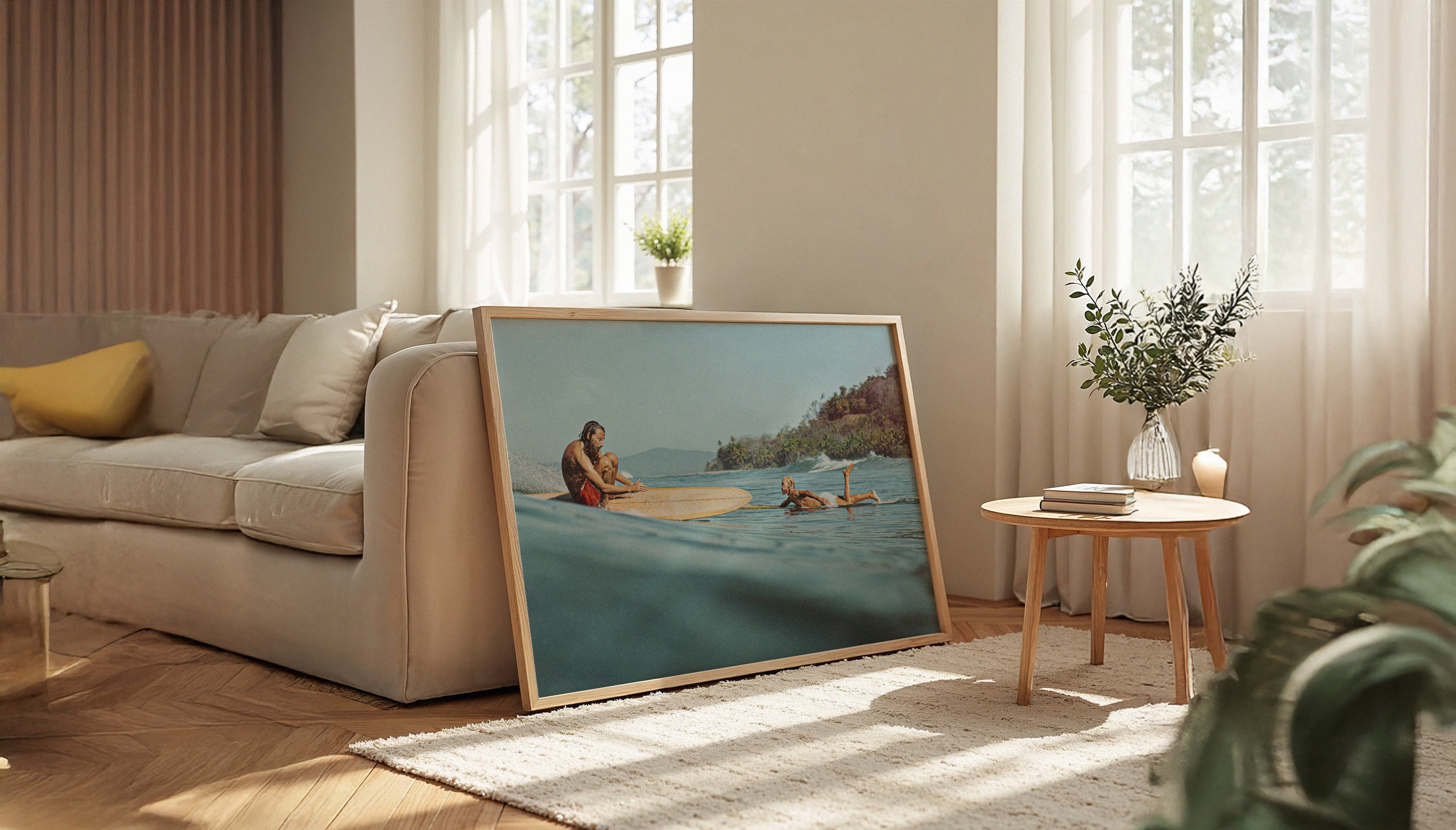 Ez Rivero's SMOOTH RIDE fine art print in a large sized wooden frame in a living room setting, with a pair of longboarders against an idillyc Costa Rican backdrop.
