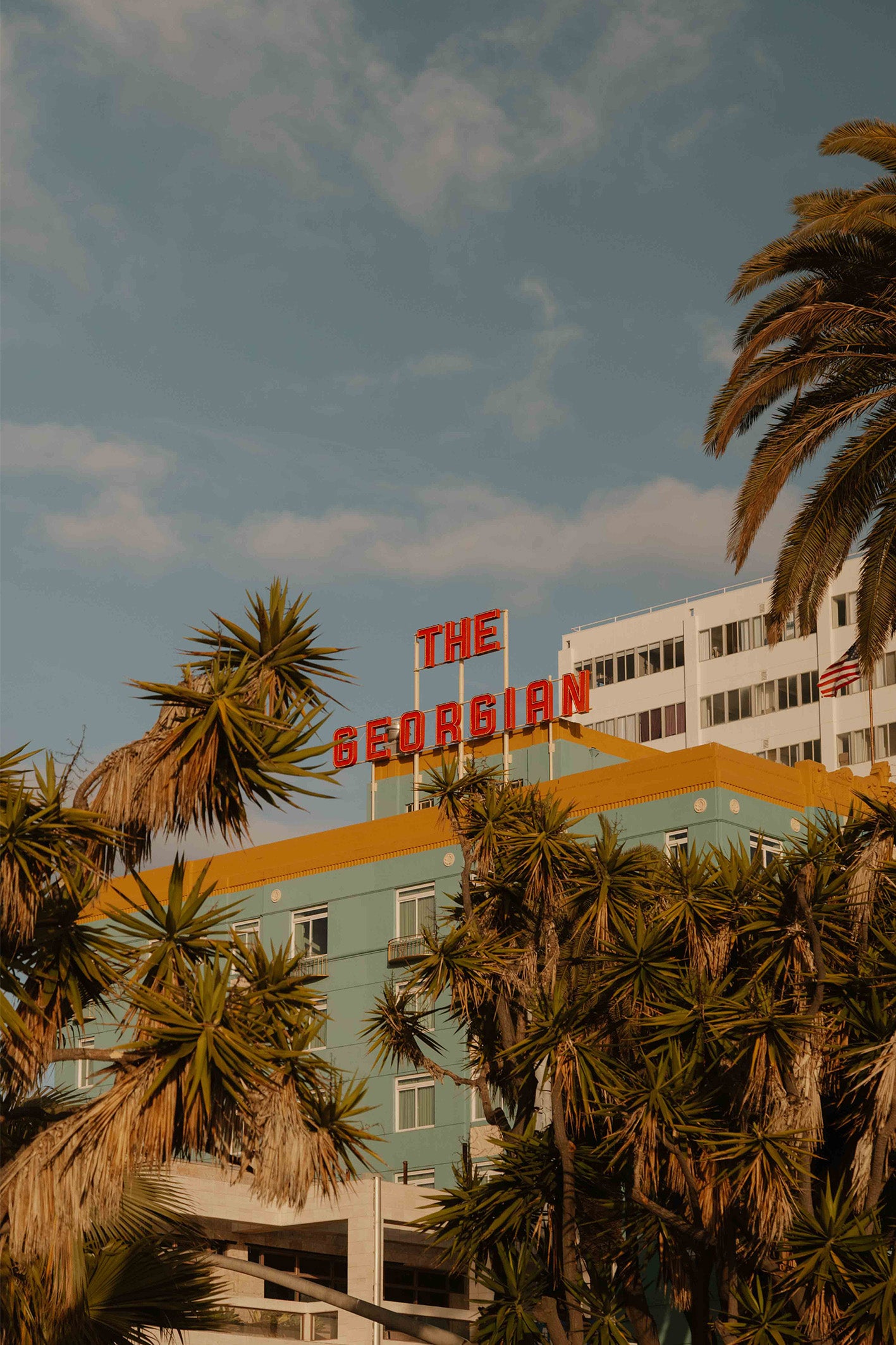A ready-to-hang framed photography print by Hannes Klaeger. The Georgian is a local landmark in Santa Monica, LA, known for its handsome turquoise Art Deco façade.
