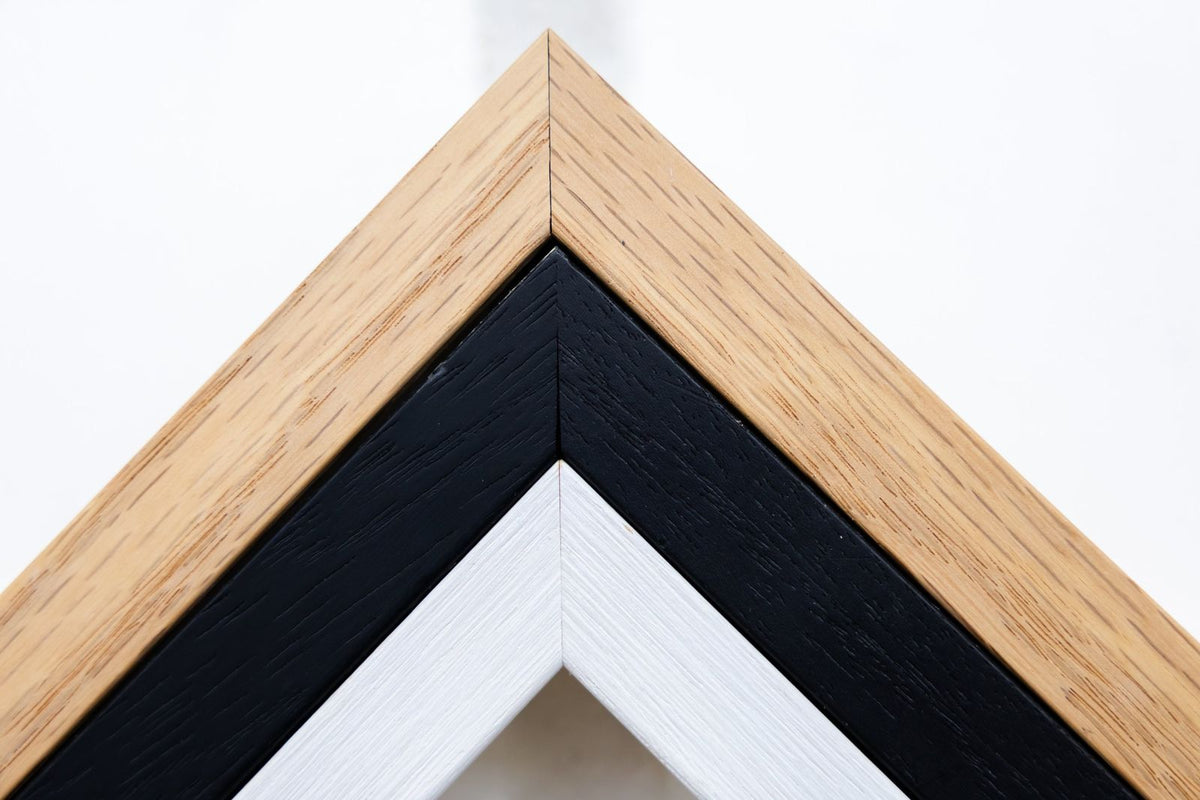 Corners of solid oak, black and white hand-crafted frames